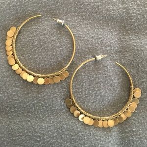 Gold hoop earrings with round dangles
